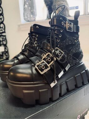 LAMODA Rough Racer Platform Boots
- Black Glitter